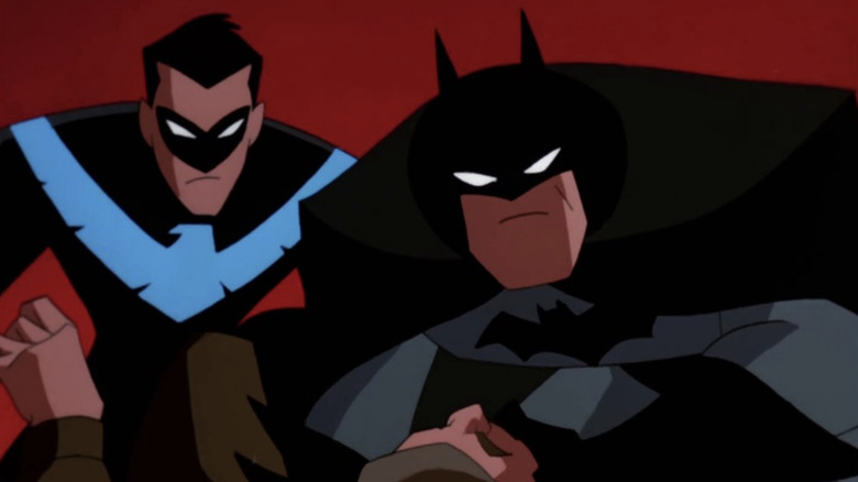 Nightwing and Batman deal with a criminal on The New Batman Adventures (1997-1999)