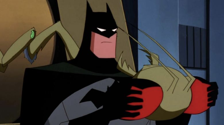 Batman holds the head of an insect creature on The New Batman Adventures (1997-1999)