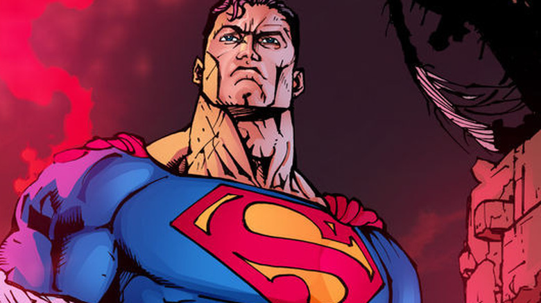 Superman holding Batman's corpse