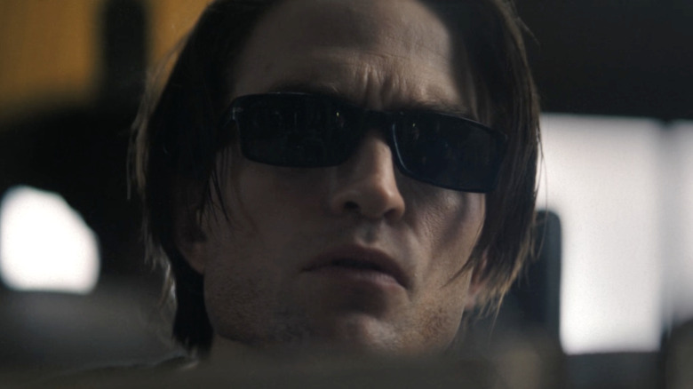 Bruce Wayne wearing sunglasses