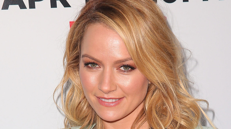 Becki Newton smiling at an event