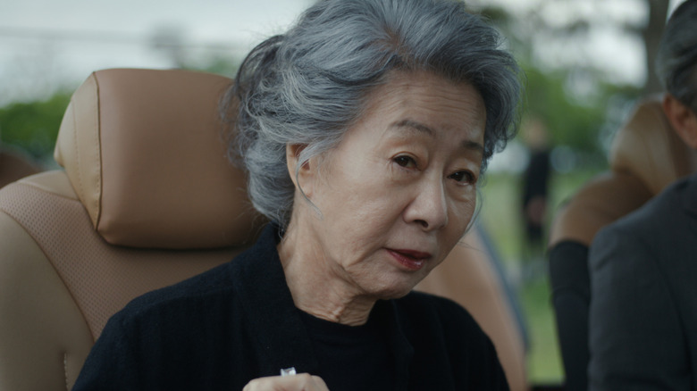 Chairwoman Park sitting in her car in 