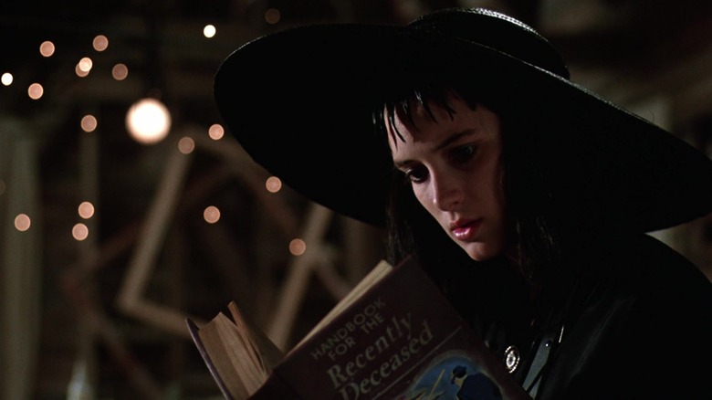 Lydia reading from the Handbook for the Recently Deceased