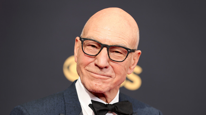 Patrick Stewart smiling and wearing glasses