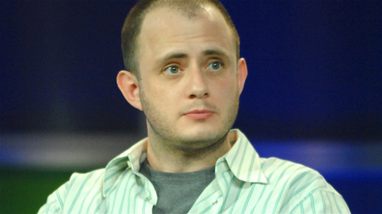 Eric Kripke sitting onstage for a 