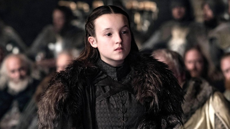 Lyanna Mormont wearing a fur cloak