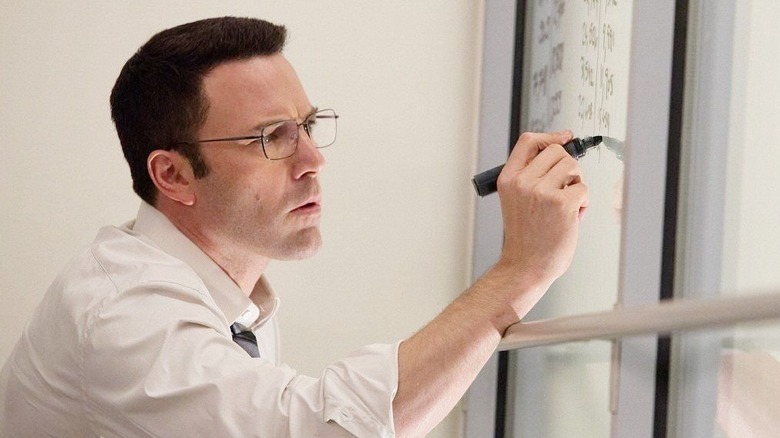 Chris Wolff writing on glass