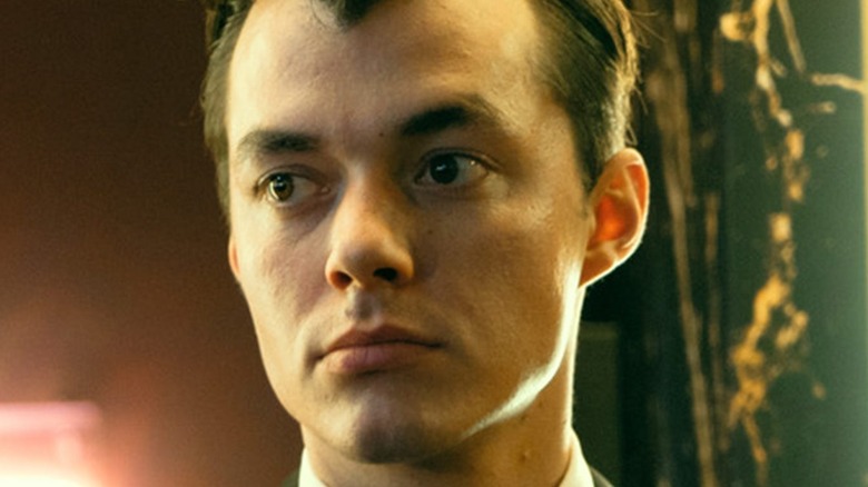 Pennyworth scowling