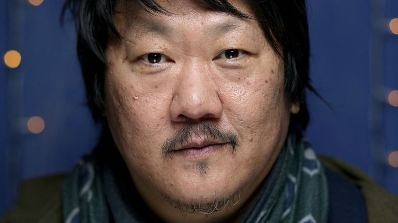 Benedict Wong staring forward