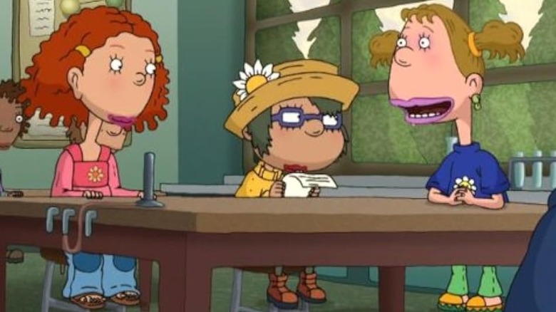 Ginger sitting at a desk with Dodie and Macie on As Told By Ginger