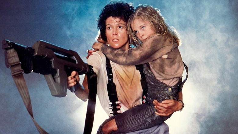 Ellen Ripley carrying Newt in Aliens