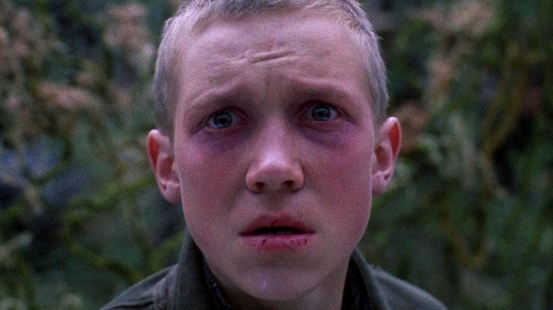 Close-up of Flyora with tears in his eyes in Come and See (1985)