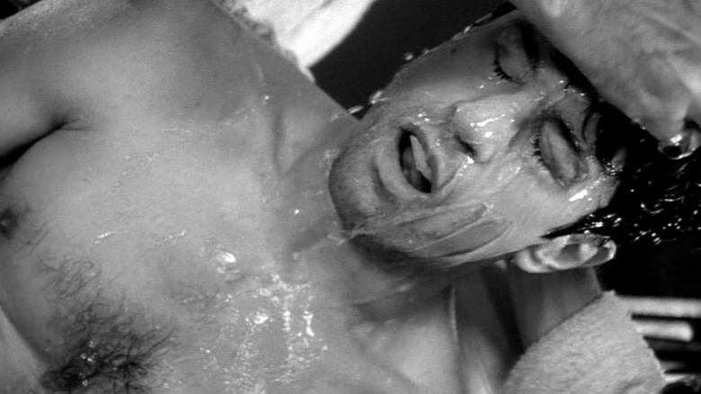 Jake LaMotta has water poured on his head in Raging Bull (1980)