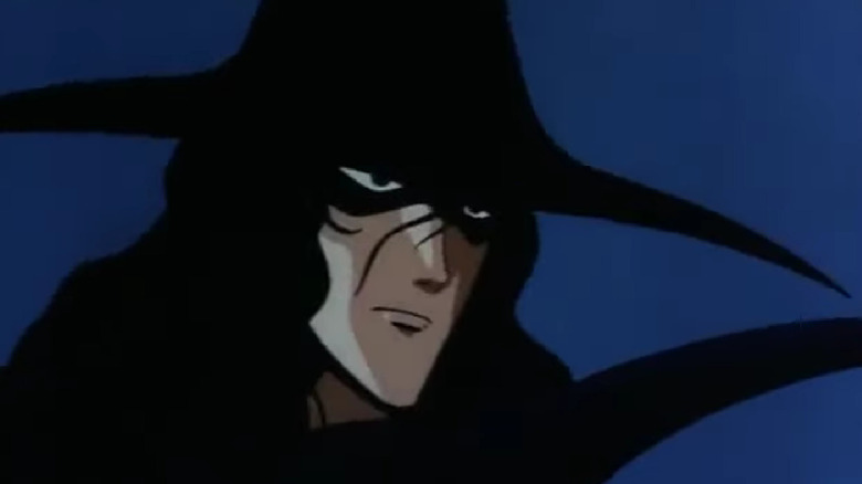 D glares from under a broad-brimmed hat