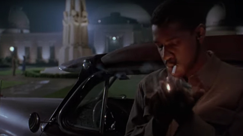 Easy Rawlins lights a cigarette