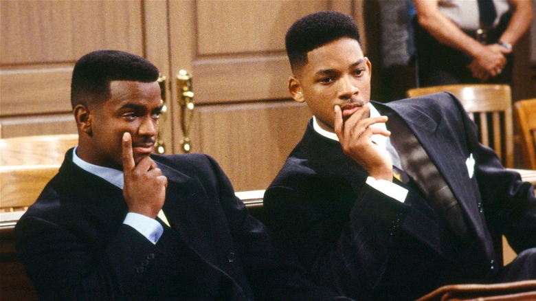 Will and Carlton sitting looking serious in a courtroom