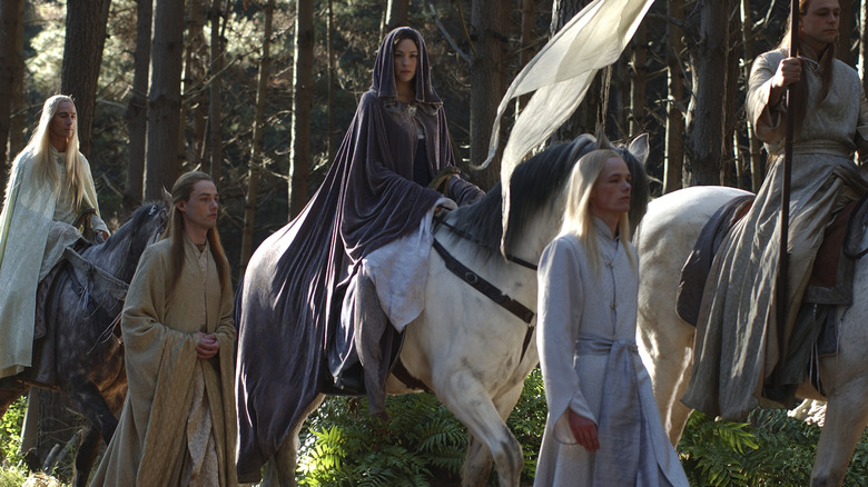 Arwen riding a horse with other Elves in The Lord of the Rings: The Return of the King (2003)