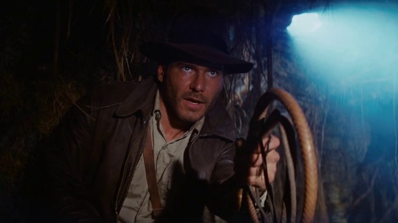 Indiana Jones holding a whip