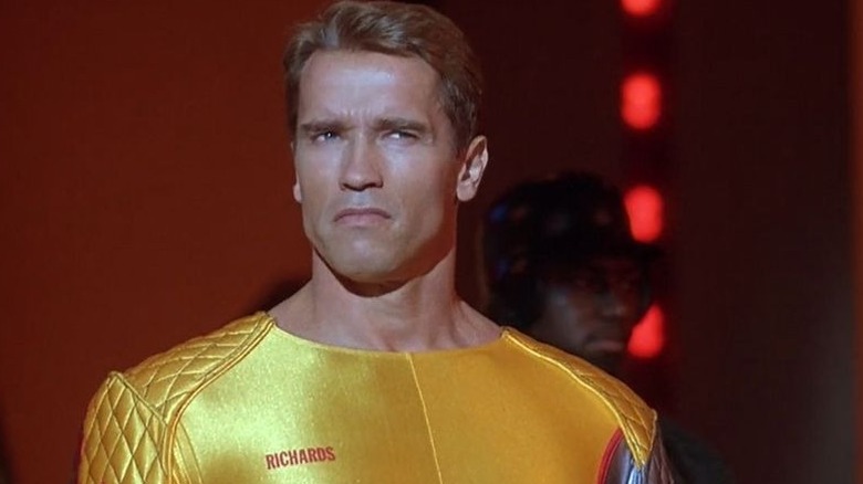 Arnold squints in a yellow leotard