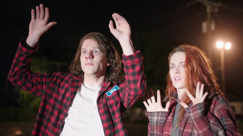 Jesse Eisenberg and Kristen Stewart put their hands up