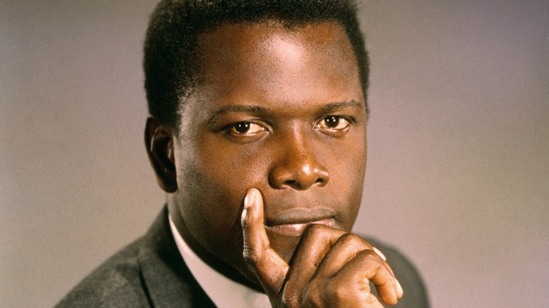 Sydney Poitier posing in a suit
