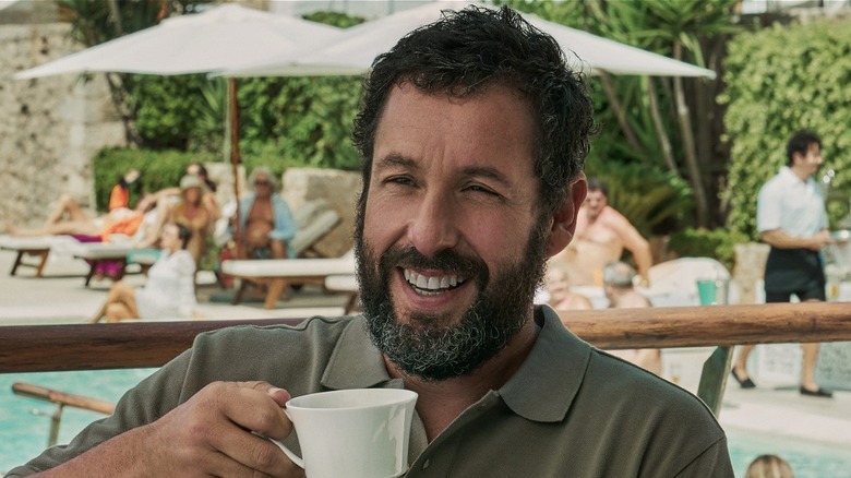 Stanley Sugerman smiling while holding mug outside