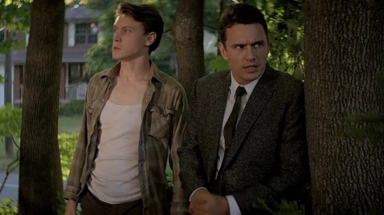 Bill and Jake hiding behind a tree in 11.22.63 (2016)