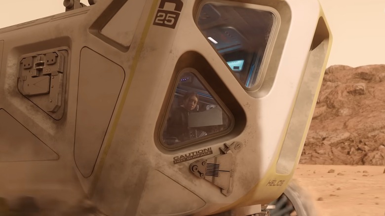 Woman looking out space rover window in For All Mankind (2019)