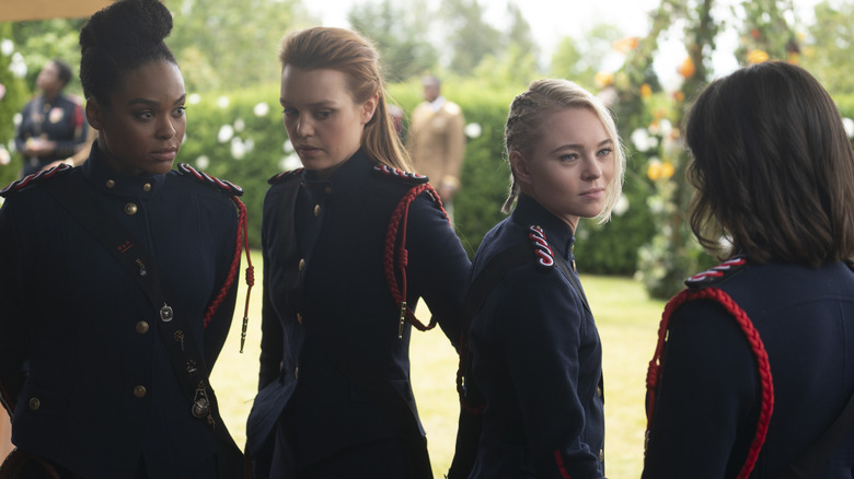 Raelle, Anacostia, Scylla, and Tally gathered outside in Motherland: Fort Salem (2020)