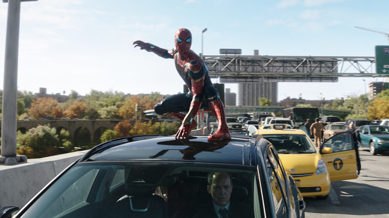 Spider-Man on top of car