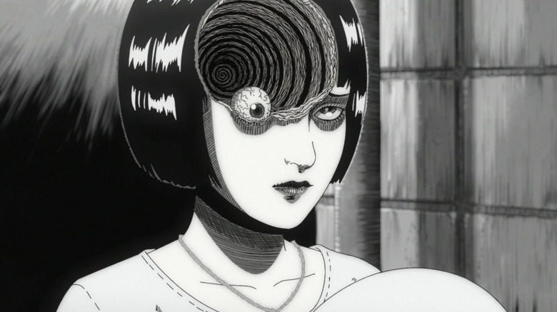 A spiral consumes Azami's head around her eyeball in Uzumaki