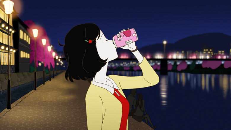 Girl drinks from soda can