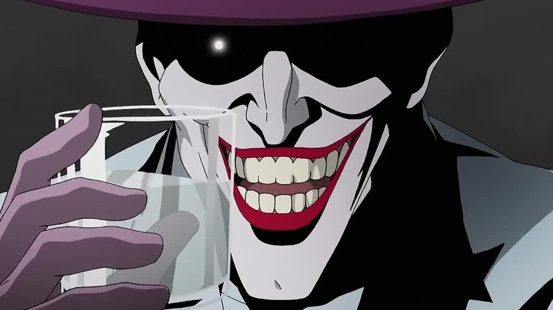 Joker grinning with glass