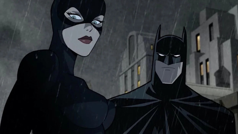 Catwoman and Batman in rain