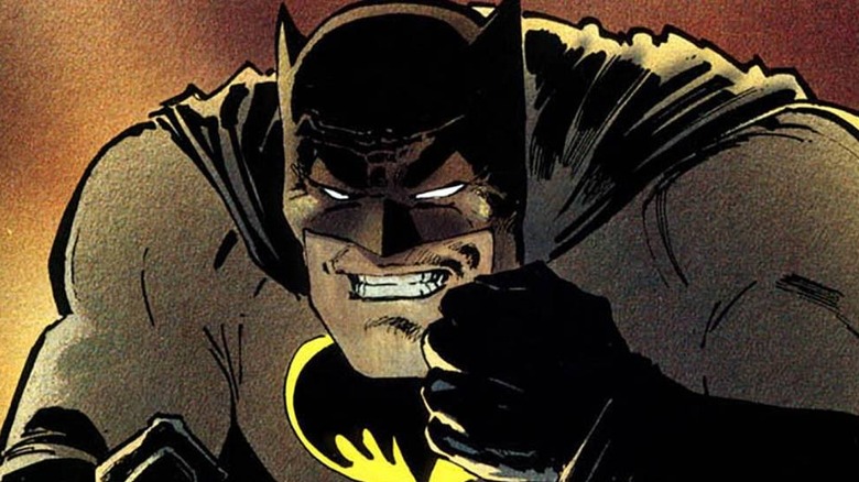 Batman throwing Batarangs at an unseen enemy