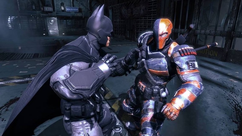 Batman getting ready to punch Deathstroke in Batman: Arkham Origins