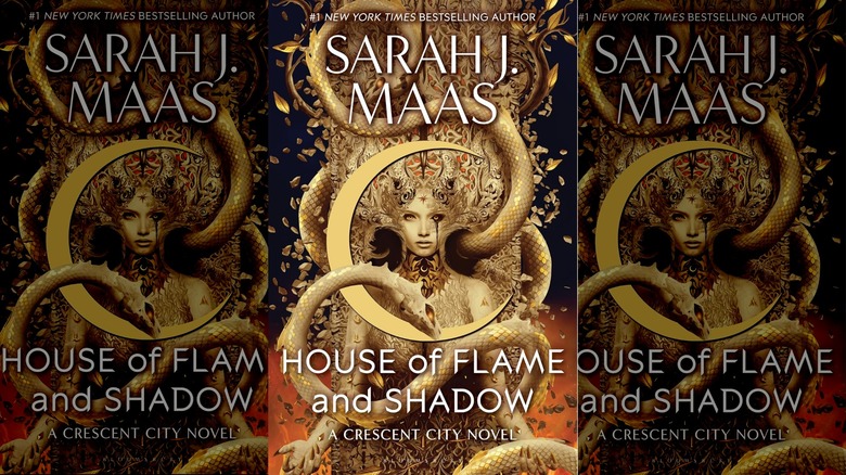 Three copies of the cover of House of Flame and Shadow by Sarah J. Maas