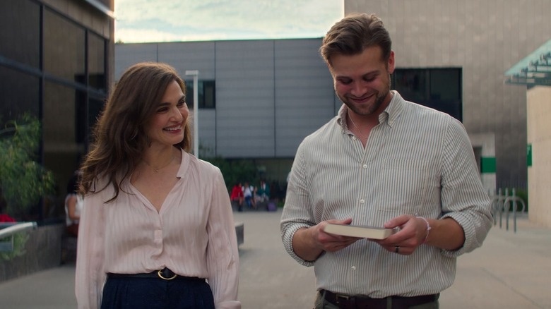 M and Vladimir walk together outside in Vladimir