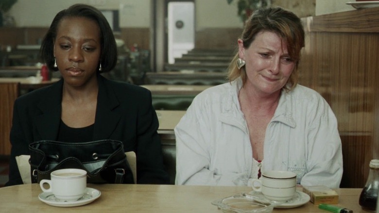 Hortense and Cynthia sitting side by side at a table in Secrets & Lies