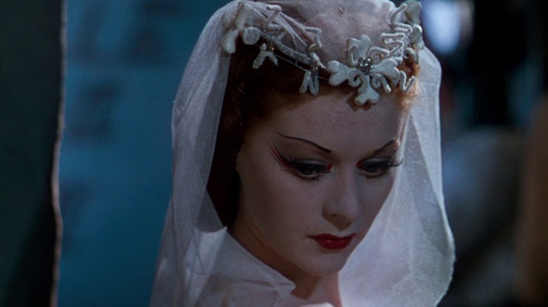 Victoria in full costume looking down over her right shoulder in The Red Shoes