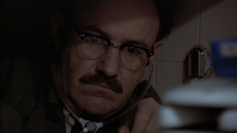 Harry Caul listening intently in secret in The Conversation (1974)