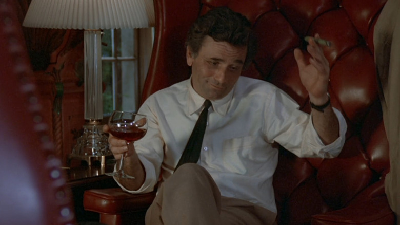 Columbo sitting in a chair, drinking wine and smoking in "How to Dial a Murder" (1978)
