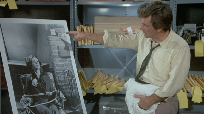 Columbo points at a blown-up photo of a victim in "Negative Reaction" (1974)