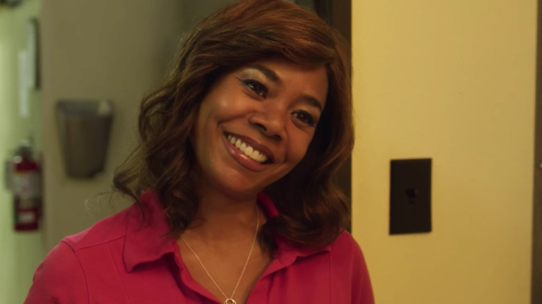 Lisa Conroy smiles in "Support the Girls" (2018)