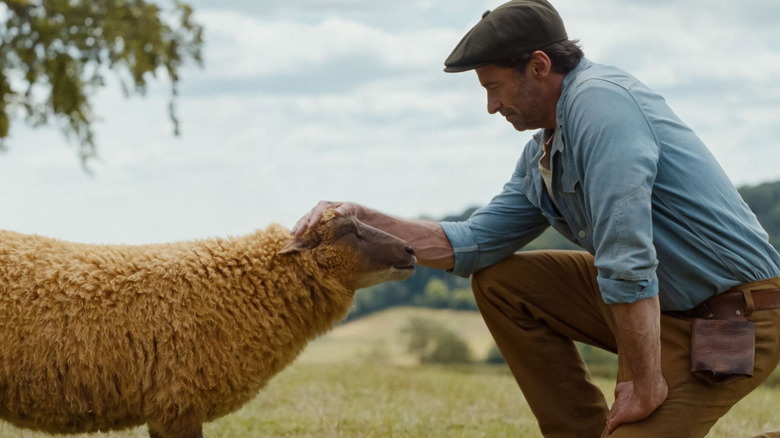 George petting Lily in "The Sheep Detectives" (2026)