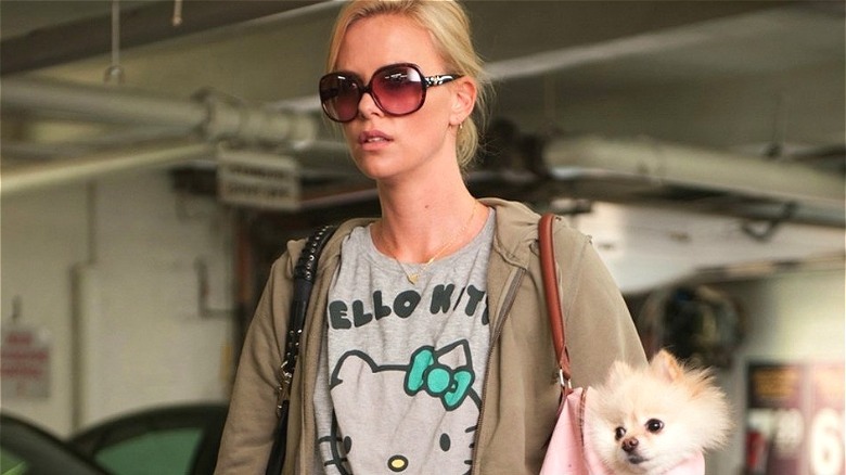 Mavis Gary carrying her dog
