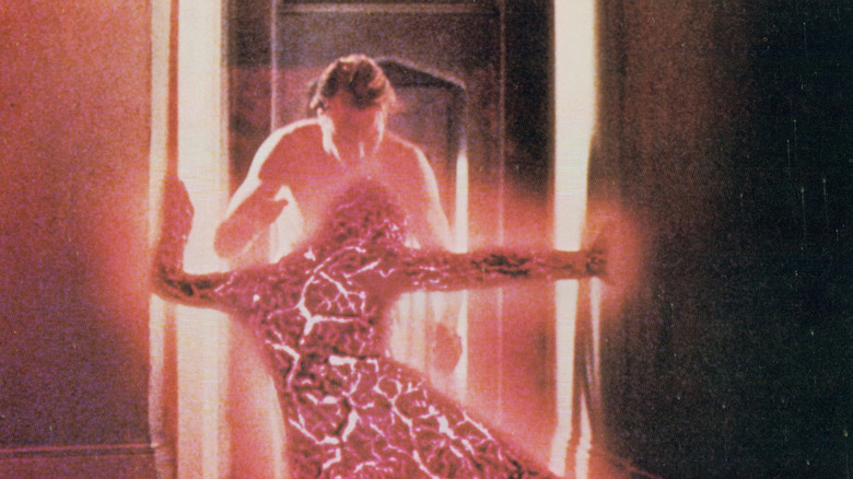 Edward Jessup reaching for a body caught between time periods in Altered States (1980)