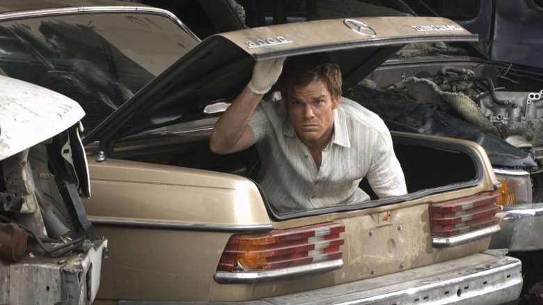 Dexter peers out of a trunk on "Dexter"