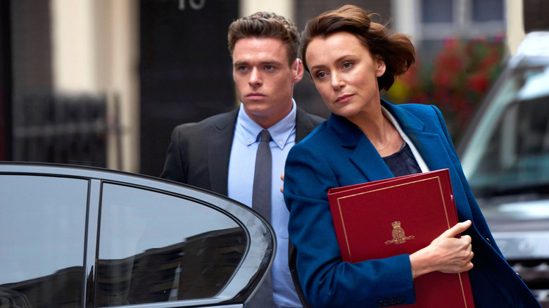 David and Julia exiting a car in Bodyguard