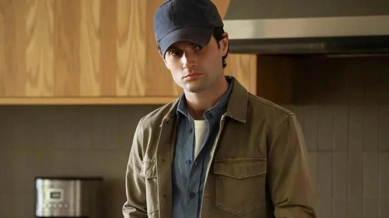 Joe wearing his murder hat in You